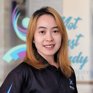Tina, an light skinned east Asian woman with shoulder length blonde hair.